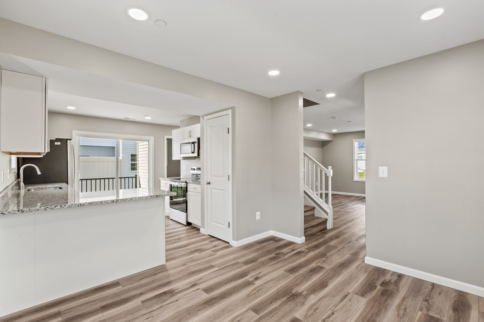 Kitchen and living area in a completed Rose model by the same builder